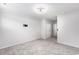 Spacious bedroom with neutral tones, plush carpeting, and a TV mount ready for entertainment at 628 Mccorkle Place, Conway, SC 29526