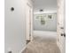 Hallway leading to a bright bedroom with three windows that bring in a lot of natural light at 628 Mccorkle Place, Conway, SC 29526