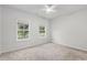 Cozy bedroom with carpet floors and two windows that flood the room with natural light at 628 Mccorkle Place, Conway, SC 29526