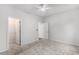 Bedroom with neutral tones, carpet floors, closet, and ceiling fan at 628 Mccorkle Place, Conway, SC 29526