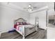 Spacious bedroom features a ceiling fan, grey wood floors, and ensuite bathroom at 628 Mccorkle Place, Conway, SC 29526