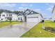 Attractive home with manicured lawn, blue accent siding, and a pristine two-car garage at 628 Mccorkle Place, Conway, SC 29526