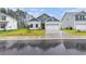 Charming home with a manicured lawn, two-car garage, and stylish blue and white siding at 628 Mccorkle Place, Conway, SC 29526