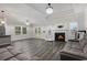 Sun-drenched living room features modern decor, fireplace and hardwood flooring at 628 Mccorkle Place, Conway, SC 29526