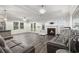 Inviting living room with ample seating, a fireplace, and stylish wood-look flooring at 628 Mccorkle Place, Conway, SC 29526