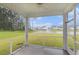 Screened-in porch with picturesque views of the pond, fountain and manicured lawn at 628 Mccorkle Place, Conway, SC 29526
