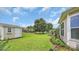 Lovely backyard featuring green grass, utility shed, patio area, and well-maintained landscaping around the perimeter at 698 Lafayette Park Dr., Little River, SC 29566