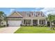Inviting brick house with dormer windows and a manicured front yard at 698 Lafayette Park Dr., Little River, SC 29566