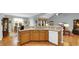 Spacious kitchen island with granite countertops, custom cabinets, and stainless sink at 698 Lafayette Park Dr., Little River, SC 29566