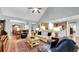 Spacious living room featuring hardwood floors, ceiling fan, and comfortable seating at 698 Lafayette Park Dr., Little River, SC 29566