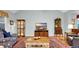 Open living room with hardwood floors, a ceiling fan, and lots of natural light at 698 Lafayette Park Dr., Little River, SC 29566