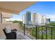 This balcony has a view of a high-rise building, parking, and trees at 7601 N Ocean Blvd. # 7-C, Myrtle Beach, SC 29572