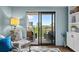 Cozy living area with sliding glass doors leading to a balcony with beautiful city and ocean views at 7601 N Ocean Blvd. # 7-C, Myrtle Beach, SC 29572