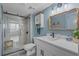 Charming bathroom featuring a glass shower, modern fixtures, and a stylish vanity with a framed mirror at 7601 N Ocean Blvd. # 7-C, Myrtle Beach, SC 29572