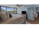 A bedroom with a ceiling fan and windows at 7601 N Ocean Blvd. # 7-C, Myrtle Beach, SC 29572