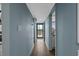Light-blue hallway showcases natural light filtering through an exterior door at 7601 N Ocean Blvd. # 7-C, Myrtle Beach, SC 29572
