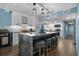 Updated kitchen featuring an island with seating, modern lighting, and ample counter space with stainless steel appliances at 7601 N Ocean Blvd. # 7-C, Myrtle Beach, SC 29572