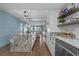 Open-concept kitchen flowing into the living area, featuring a large island and stainless steel appliances at 7601 N Ocean Blvd. # 7-C, Myrtle Beach, SC 29572