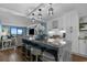 Bright and airy kitchen open to the living room featuring an island with seating and stainless steel appliances at 7601 N Ocean Blvd. # 7-C, Myrtle Beach, SC 29572