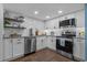 Updated kitchen with stainless steel appliances, white subway tile backsplash, and granite countertops at 7601 N Ocean Blvd. # 7-C, Myrtle Beach, SC 29572