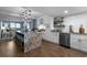 Modern kitchen features a granite island with seating, modern white cabinets, and stainless-steel appliances at 7601 N Ocean Blvd. # 7-C, Myrtle Beach, SC 29572