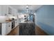 Beautifully remodeled kitchen with a spacious island, granite countertops, wine storage, and stainless steel appliances at 7601 N Ocean Blvd. # 7-C, Myrtle Beach, SC 29572