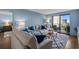 Open living area showcases modern decor, balcony access, and comfortable seating with bright, natural light at 7601 N Ocean Blvd. # 7-C, Myrtle Beach, SC 29572