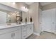 Bathroom with double sink vanity, mirrors, and tile flooring at 908 Pelagic Loop, Myrtle Beach, SC 29579