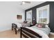Charming bedroom with Americana decor, featuring two twin beds, ceiling fan, and natural light at 908 Pelagic Loop, Myrtle Beach, SC 29579
