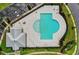 Aerial view of community pool area with lounge chairs and lush landscaping at 908 Pelagic Loop, Myrtle Beach, SC 29579