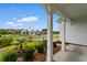 Inviting front porch view showcasing lush landscaping and a glimpse of the charming neighborhood streetscape at 908 Pelagic Loop, Myrtle Beach, SC 29579