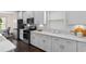 Well-designed kitchen featuring stainless steel appliances, white cabinetry, and modern finishes for an efficient design at 908 Pelagic Loop, Myrtle Beach, SC 29579