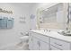 Bright bathroom featuring white vanity with mosaic-framed mirror and beach-themed decor at 914 Mary Read Dr., North Myrtle Beach, SC 29582