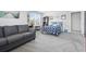 Spacious bedroom with calming grey walls, a cozy sofa and inviting decor touches at 914 Mary Read Dr., North Myrtle Beach, SC 29582