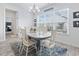 Dining room with a view of the windows, wood-look floors, chandelier, and coastal decor at 914 Mary Read Dr., North Myrtle Beach, SC 29582