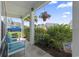 Inviting porch with comfortable seating and vibrant hanging plants, perfect for enjoying peaceful outdoor moments at 914 Mary Read Dr., North Myrtle Beach, SC 29582