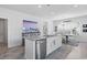 Kitchen island with stainless steel dishwasher, granite counters, and view of the dining area at 914 Mary Read Dr., North Myrtle Beach, SC 29582