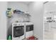 Functional laundry room equipped with modern washer and dryer, plus shelving for storage at 914 Mary Read Dr., North Myrtle Beach, SC 29582