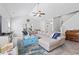 Spacious living room with a comfortable sectional, beachy-blue accents, and plenty of natural light at 914 Mary Read Dr., North Myrtle Beach, SC 29582