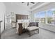 Spacious main bedroom with large window, tray ceiling, king bed and carpet flooring at 914 Mary Read Dr., North Myrtle Beach, SC 29582