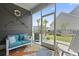 Comfortable screened porch offers outdoor living with cozy seating and view of the lush backyard at 914 Mary Read Dr., North Myrtle Beach, SC 29582