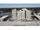 A stunning aerial view of a beachfront condo community with pools and beautiful landscaping at 9550 Shore Dr. # 1733, Myrtle Beach, SC 29579