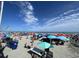Wide beach shot showcasing many umbrellas, people, and the ocean at 9550 Shore Dr. # 1733, Myrtle Beach, SC 29579