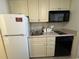 Compact kitchen with white appliances and ample cabinet space at 9550 Shore Dr. # 1733, Myrtle Beach, SC 29579