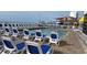 This is a view of an outdoor pool and lounge chairs with an ocean view at 9550 Shore Dr. # 1733, Myrtle Beach, SC 29579