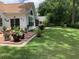 Spacious backyard with lush green lawn and brick paver patio, perfect for outdoor living at 9614 Indigo Creek Blvd., Murrells Inlet, SC 29576
