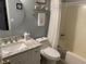 Well-lit bathroom features a white vanity with granite countertop and shower/tub combination at 9614 Indigo Creek Blvd., Murrells Inlet, SC 29576