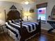 Charming bedroom with a nautical theme, dark wooden furniture, and hardwood floors at 9614 Indigo Creek Blvd., Murrells Inlet, SC 29576