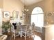 Bright dining area with stylish chandelier and elegant fireplace, perfect for entertaining at 9614 Indigo Creek Blvd., Murrells Inlet, SC 29576