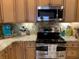 Close up of kitchen with stainless steel appliances and beautiful granite countertops at 9614 Indigo Creek Blvd., Murrells Inlet, SC 29576